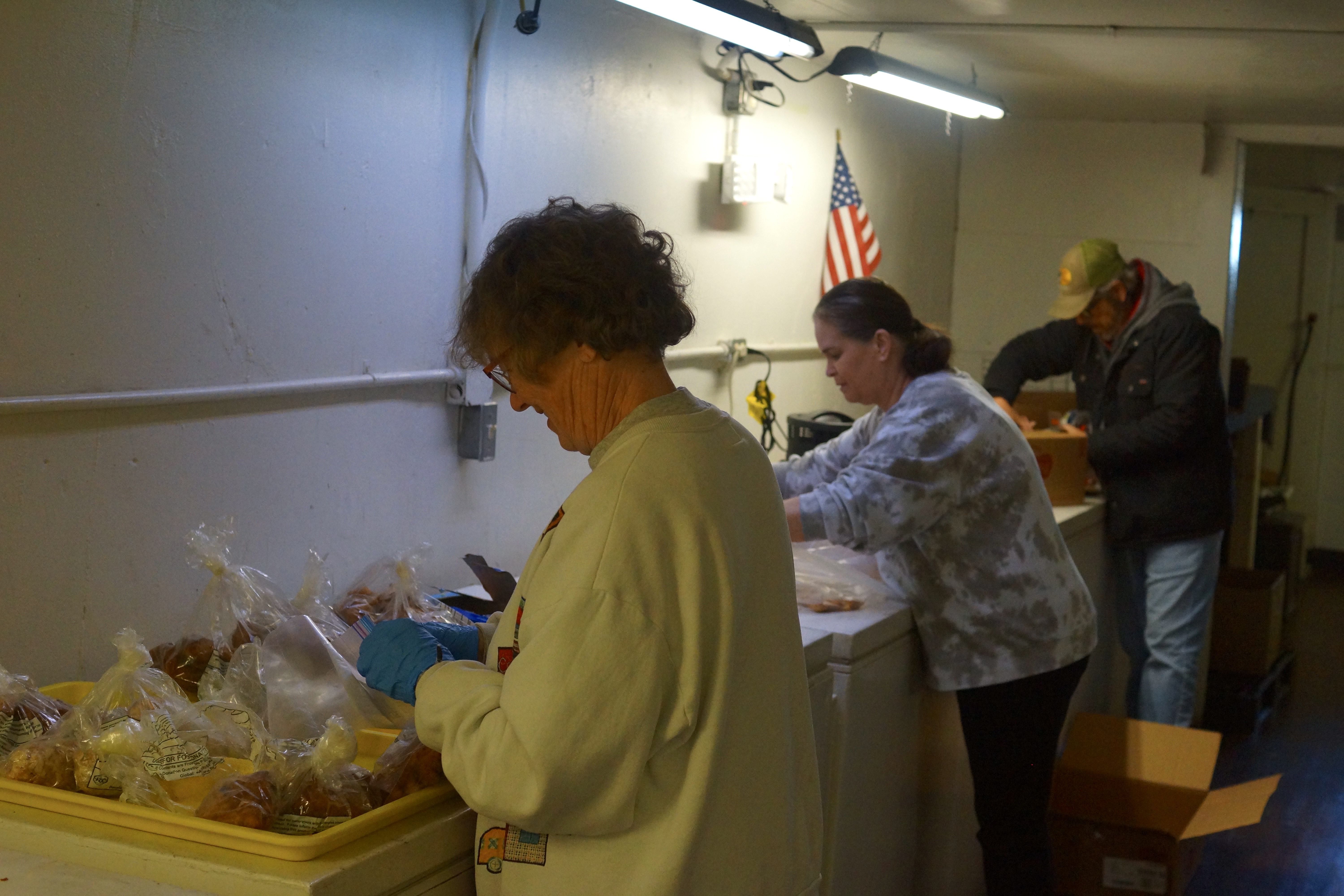 Volunteer packing lunches for those in need